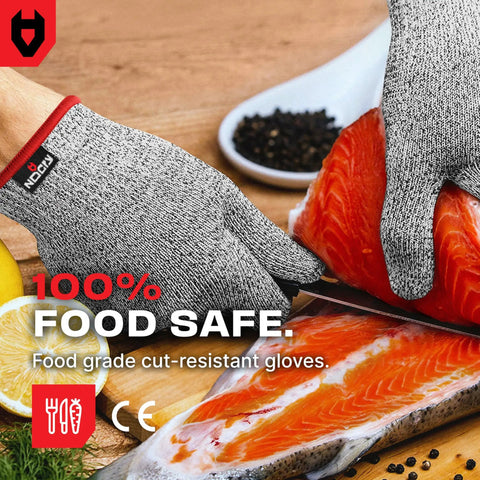 Hands wearing Premium Cut Resistant Kitchen Gloves Level 5 Food Grade For Chefs And Butchers, slicing salmon.