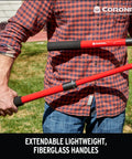 Man holding Extendable Handles Compound Action Bypass Lopper For Thick Branches Up To One And A Half Inches with red fiberglass handles.