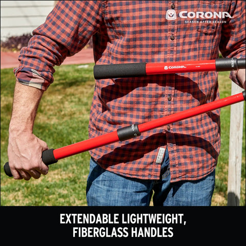 Man holding Extendable Handles Compound Action Bypass Lopper For Thick Branches Up To One And A Half Inches with red fiberglass handles.