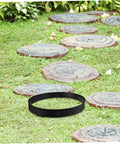 Round Concrete Paver Mold For DIY Garden Pathways Reusable Cement Mould For Landscaping And Outdoor Decor Easy To Use Pavement Form For Patio Paths Walkways And Lawn Edges on grass with stepping stones.