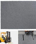 Heavy Duty Non Skid Forklift Floor Mat And Tractor Cab Protector With Tough As Nails Rubber Deck Pad on gray floor.