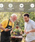 Two men grilling with 21 Piece Heavy Duty Stainless Steel BBQ Tool Set With Apron And Aluminum Case, enjoying a sunny cookout.