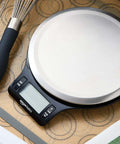 Top view of Digital Kitchen Scale With Large LCD Display And Tare Function Pro-Grade Measures In Pounds Ounces Grams Milliliters Stainless Steel