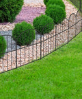 Arched rustproof metal garden fence panels for 10 feet long by 16.5 inches high, decorative edging and animal barrier installed in garden.