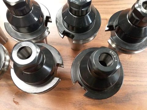 Top view of CAT40 ER16 collet chucks 8 piece heavy duty set for CNC milling machining centers with thick neck design.