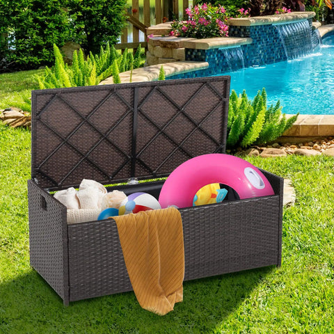 Outdoor 34 Gallon Storage Bench With Seat Cushion And Waterproof Liner, Wicker Brown Deck Box With Side Handles by the pool