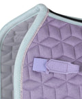 Close-up of Suede Elite Air Tec Dressage Saddle Pad with quilted Lilac suede, vegan leather girth patch, and breathable spine