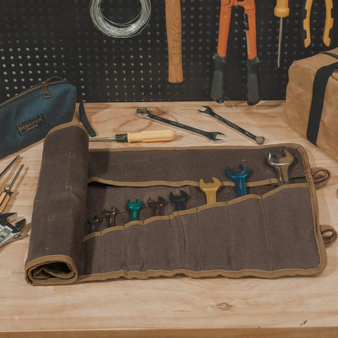 Heavy Duty Waxed Canvas Tool Roll Bag With 24 Pockets Roll Up Pouch For Wrenches And Tools Waterproof 16oz Canvas open on workbench