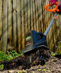 20V Cordless Garden Tiller Cultivator with 7.5 Inch Width in use, tilling soil near wooden fence, highlighting steel tines