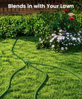 Heavy Duty 25 Foot Outdoor Extension Cord Featuring Three Badass Multiple Outlets And 18 Gauge Weatherproof Construction in green grass.
