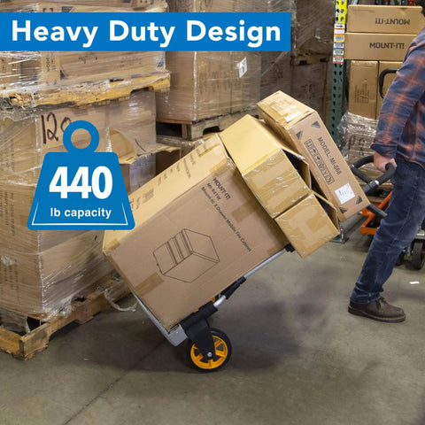 Beefy Folding Dolly With Aluminum Frame, 440 LB Capacity Hand Truck with rugged rubber wheels moving boxes in a warehouse.