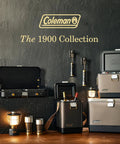 The Coleman 1900 Collection featuring camping gear with grill, coolers, and lantern on wooden surface.