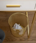 Ryder Gold Mesh Metal Trash Can 4.5 Gallon Office Wastebasket With Non Slip Feet under desk on wooden floor