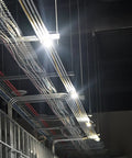Industrial ceiling installation with Outdoor 50 Ft LED String Light With 5 Lights, Weatherproof IP65 Plastic Construction.