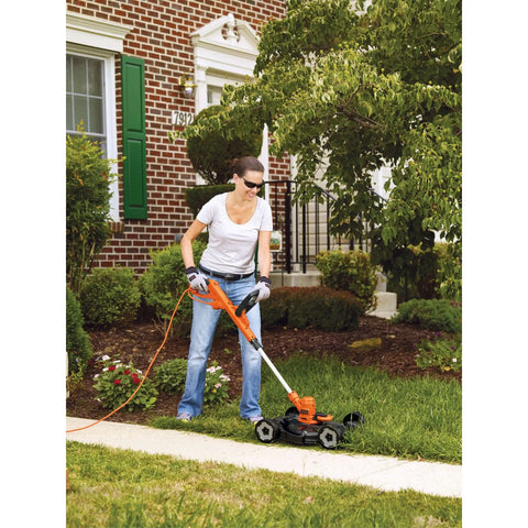 Person using 3-In-1 Electric Lawn Mower, Trimmer And Edger With 6.5 Amp Motor, 12 Inch Cutting Width, Corded Power For Quick Yard Cleanup