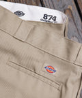 Mens Straight Leg Work Pants With Big Tall Roomy Fit Built Tough For Construction Grind And Saturday Chill Crafted From Durable Wrinkle Resistant Polyester Cotton In Khaki close-up of waistband featuring tag