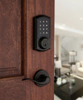 SmartCode 915 Touchscreen Electronic Deadbolt With Smart Key UL Listed Illuminated Keypad on wood door interior view