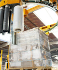 Heavy Duty Clear Cast Stretch Wrap 80 Gauge 19.7 X 6000 Ft Roll Industrial Grade Shrink Film wrapping pallets in warehouse.