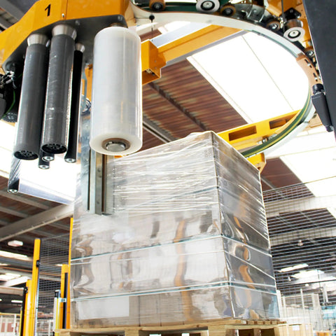 Heavy Duty Clear Cast Stretch Wrap 80 Gauge 19.7 X 6000 Ft Roll Industrial Grade Shrink Film wrapping pallets in warehouse.