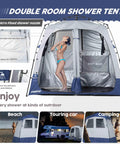 Pop Up Portable Camping Shower Tent Deluxe Changing Room Privacy Shelter Two Rooms With Floor Drain For Beach Camp And Hiking Easy Setup No Tools Stakes And Ropes For Stability with a person inside showing dual-room use at campsite.