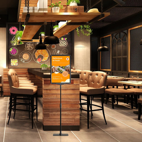 Sign Holder Stand For 8.5x11 Signs Tabletop And Floor Display in cafe, featuring an adjustable height with a stable base and menu