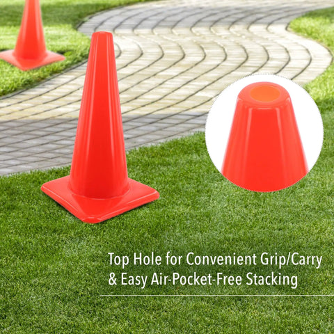 Bright Orange 18 Inch Traffic Cone Built Tough For Weather Resistance on grass with focus on top grip detail