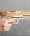 Wolf 01 Handgun 3D Wooden Puzzle Kit For Adults With Mechanical Moving Parts And Realistic Wood Model Gun Brain Teaser And Hobby Set, side view in hand