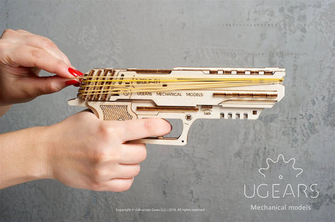 Wolf 01 Handgun 3D Wooden Puzzle Kit For Adults With Mechanical Moving Parts And Realistic Wood Model Gun Brain Teaser And Hobby Set, side view in hand
