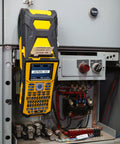 Built Tough Portable Handheld Label Maker With Rechargeable Battery For Multi Line Wire Tagging displayed on an electrical panel.