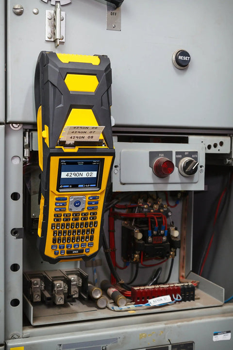 Built Tough Portable Handheld Label Maker With Rechargeable Battery For Multi Line Wire Tagging displayed on an electrical panel.