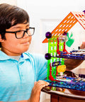 Child constructing with Elenco My Home Electronics Building Kit For Kids Aged 8 And Up With 34 Hands On STEM Projects And Color Coded Blocks
