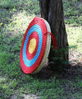 Backyard Archery Target For Adults And Youth, Easy Arrow Removal And Durable Straw Target For Outdoor Practice, leaning against tree