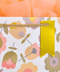 Close-up of Two Pack 9 Inch Flower Gift Bags With Tissue Paper Featuring Tulip Floral Design with orange tissue paper