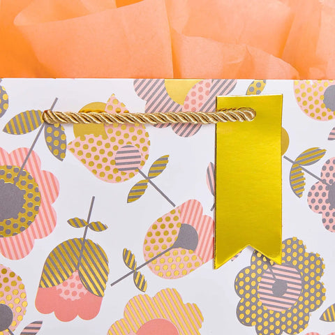 Close-up of Two Pack 9 Inch Flower Gift Bags With Tissue Paper Featuring Tulip Floral Design with orange tissue paper