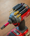 Heavy Duty Drill And Impact Driver Bit Holder With Silicone Bandolier And 3M Adhesive Universal Pro Grade Quick Change Bit Organizer For Fast Access 10 Slot Drill Accessories attached to a Milwaukee drill with bits installed, focus on bit holder and accessories.