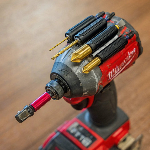 Heavy Duty Drill And Impact Driver Bit Holder With Silicone Bandolier And 3M Adhesive Universal Pro Grade Quick Change Bit Organizer For Fast Access 10 Slot Drill Accessories attached to a Milwaukee drill with bits installed, focus on bit holder and accessories.