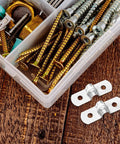 Two Heavy Duty Stainless Steel Cable Conduit Clamps beside a box filled with various screws and fasteners.