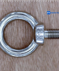 M12 Stainless Steel Lifting Eye Bolt on wood surface, highlighting industrial grade 304 stainless material and design.