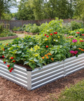 2 Pack 8 By 4 By 1 Foot Durable Galvanized Metal Raised Garden Bed Kit For Vegetables And Herbs Open Bottom Large Capacity Outdoor Planter Box With Stakes Silver, installed in a garden, full of growing vegetables and flowers.