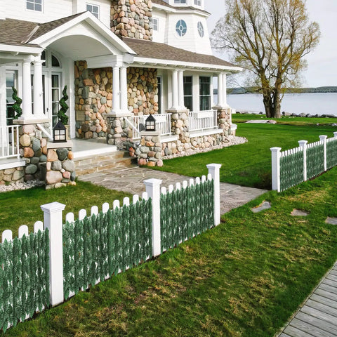 120x40 Inch Artificial Ivy Privacy Fence Screen With Faux Greenery Panels enhancing white picket fence by a lakeside house