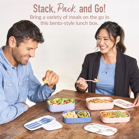 People enjoying meals with three compartment adult lunch box with built in utensil set and sealing strap in blush marble.