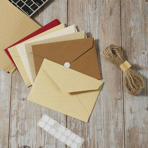 Rustic Ivory White Letter Set with jute string seals, 20 premium writing papers, and 10 heavyweight envelopes on a wooden surface