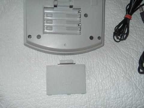 PTouch 2300 Labeling System battery compartment with cover removed, showing battery slots and power cable, no fuss stand alone