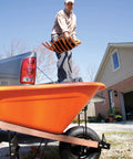 Man using All Poly Scoop Fork With 8 Tines And D Grip Handle For Mulch Compost Leaves Straw And Hay Lightweight Beveled Tines