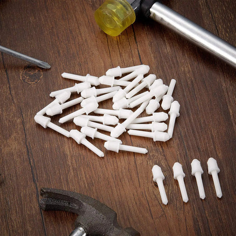 Top Shelf White Shutter Repair Pins Twenty Pack One By Point Two Five Inch Louver Pins Heavy Duty Plantation Shutters Replacement Hardware on a wooden surface.