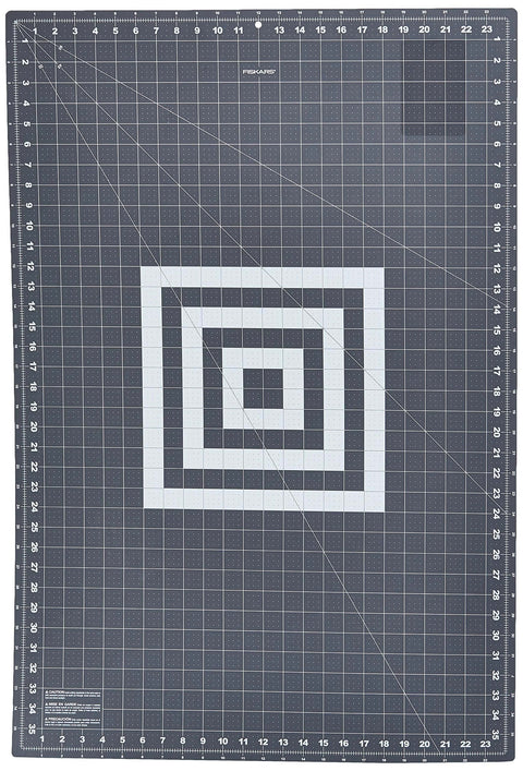 Fiskars self-healing cutting mat, 24 x 36 in, grid-lined quilting surface with edge rulers