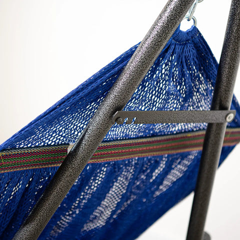 Close-up of navy heavy duty outdoor hammock with collapsible steel stand, focus on fabric texture and metal frame.