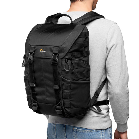 Person wearing ProTactic BP 300 AW II Mirrorless And DSLR Backpack With QuickShelf Divider System, black color, back view.