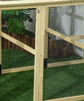 Close-up of the metal wire and wood frame of a large wooden chicken coop with run, ideal for outdoor backyard farm, 4.6 by 2.8 feet.