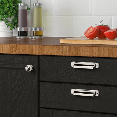Top Shelf 1 Inch Vintage Ball Cabinet Knobs Polished Nickel Drawer Pulls on black kitchen drawers with tomatoes and condiments.